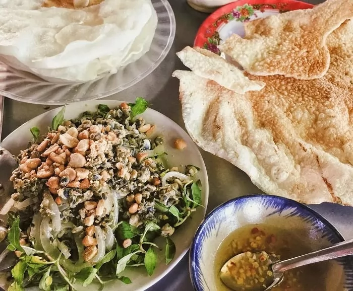 Have you tried crushed rice crackers with stir-fried clams in Hoi An?