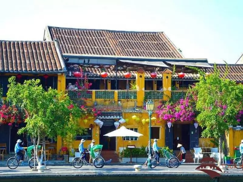 Cyclo rides follow each other in a line through the ancient streets