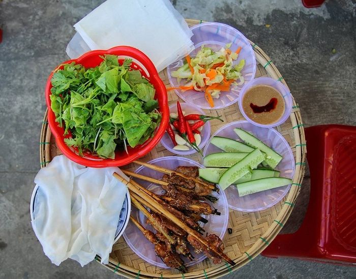 Steamed rice roll with grilled pork in Hoi An